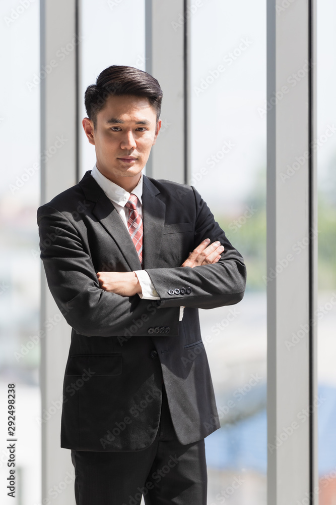 Businessman standing and crossed his arm.. Businessman standing and crossed his arm..