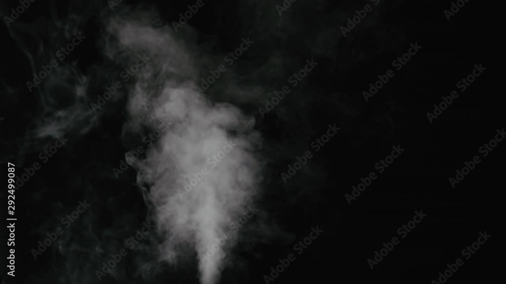 Slow motion water mist stream with wind effect over black background Slow motion water mist stream with wind effect over black background