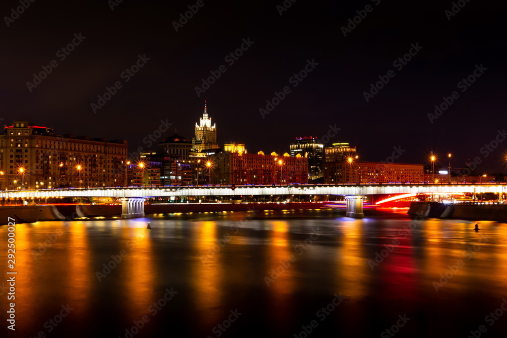 Krasnopresnenskaya embankment and Novoarbatskiy bridge. Cityscape of night Moscow.