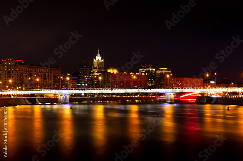 Krasnopresnenskaya embankment and Novoarbatskiy bridge. Cityscape of night Moscow.