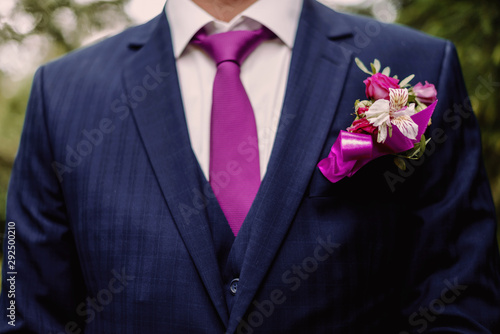Groom's boutonniere close-up. Wedding floristry. Wedding accessories
