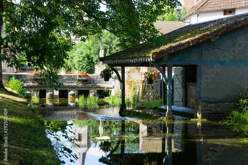 Lusigny sur Ouche old Wash-house (Lavoir) in Burgundy. River and antique bridge.