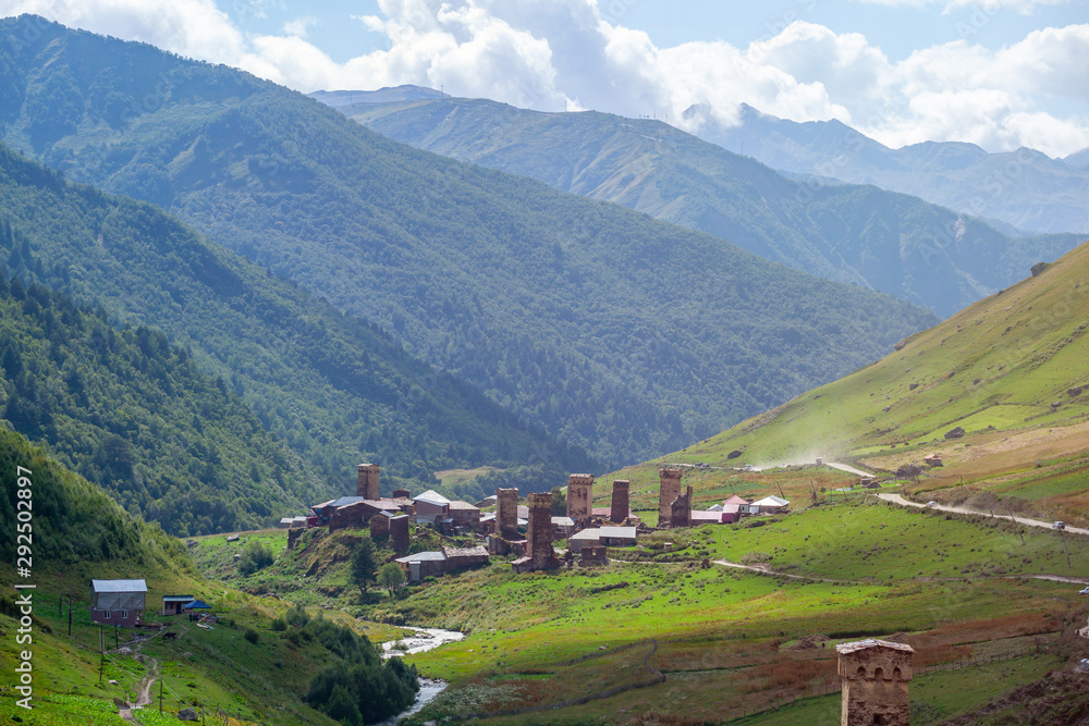 View of the Ushguli village at the foot of Mt. Shkhara. Picturesque and gorgeous scene. Rock towers and old houses in Ushguli, Georgia. View of the Ushguli village at the foot of Mt. Shkhara. Picturesque and gorgeous scene. Rock towers and old houses in Ushguli, Georgia.