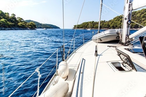 Sailing boat near Croatian island Lastovo. View from the deck of the yacht. Vacation on a boat. Sailing on the sea.
