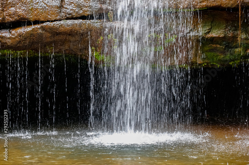 Close up of waterfall dropping into pond, Chapada dos Guimarães, Mato Grosso, Brazil, South America