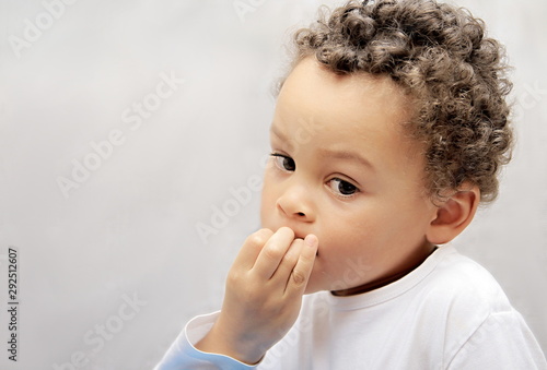 little boy sucking his thumb stock photo