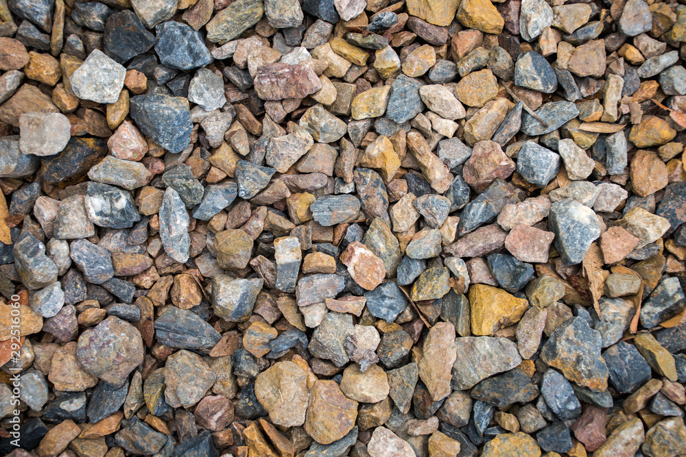 Top view of blue and brown construction gravel texture background. Top view of blue and brown construction gravel texture background.