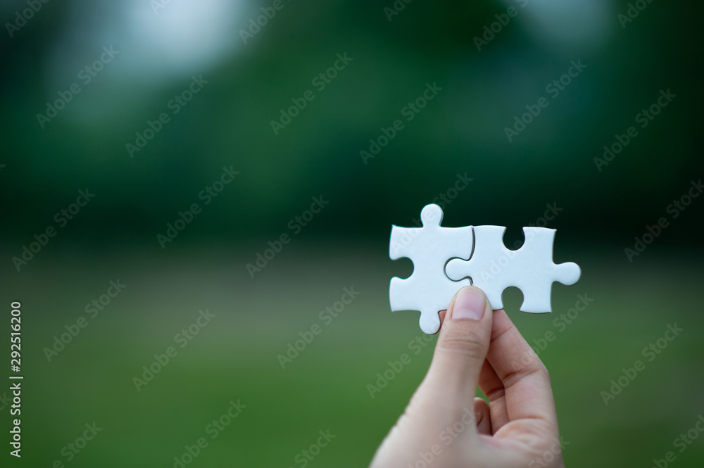 Hands and puzzles, important pieces of teamwork Teamwork concept Hands and puzzles, important pieces of teamwork Teamwork concept