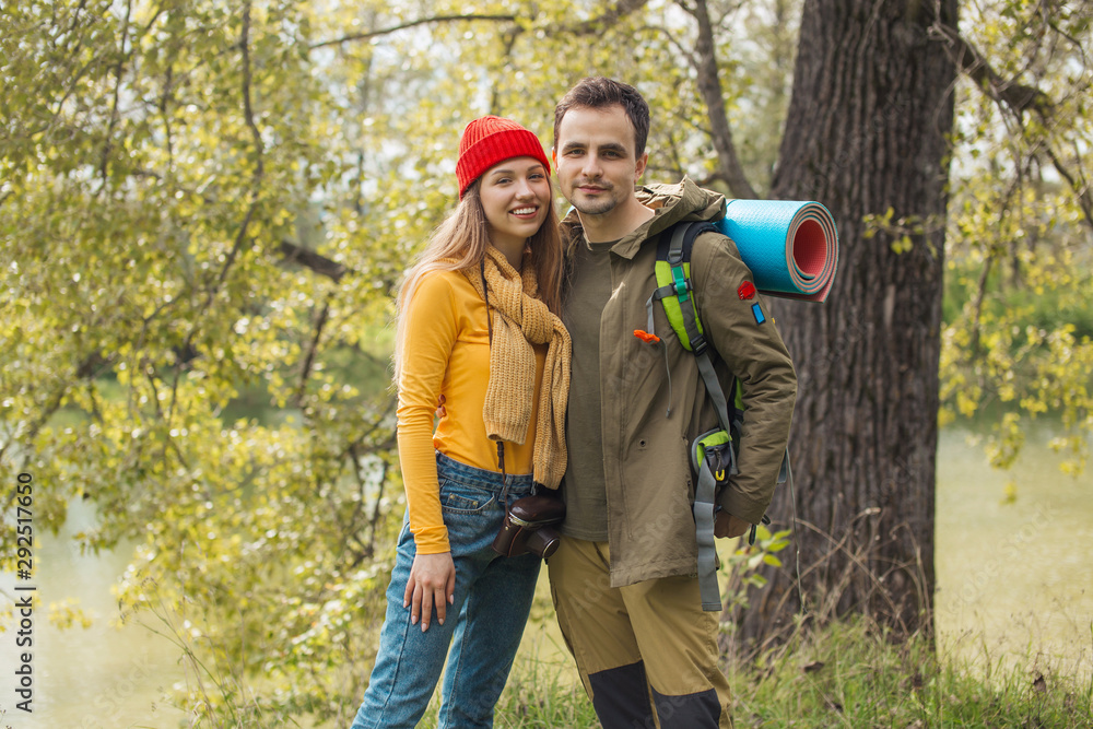 active motivated ambitious couple hiking enjoying view looking at mountain forest landscape, close up photo, travel, tourist, hobby, interest