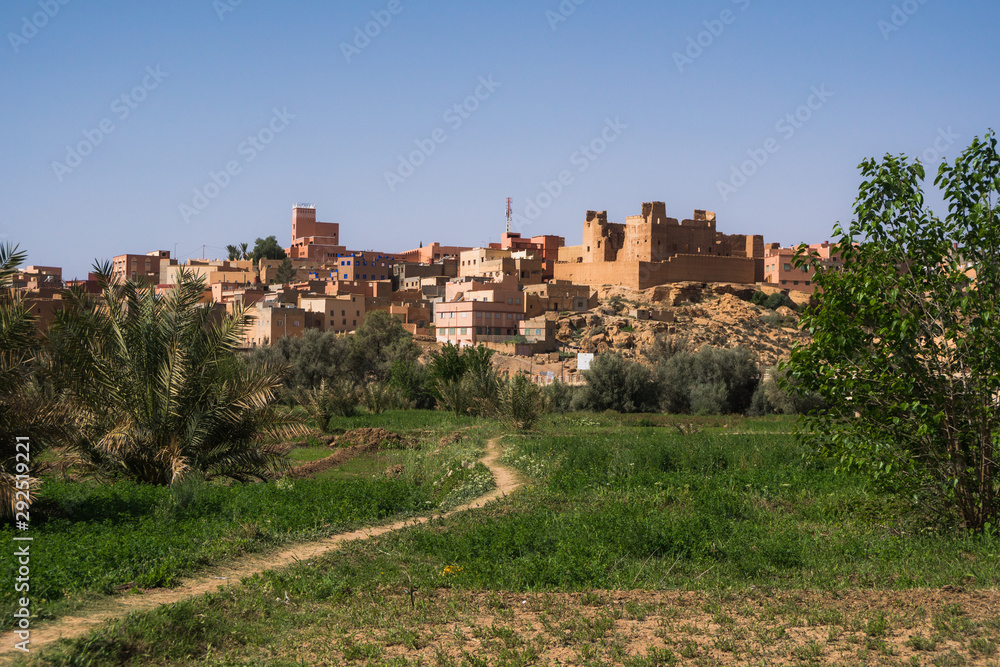 View of Tinghir city and a plain green oasis in front of the moroccan traditional village