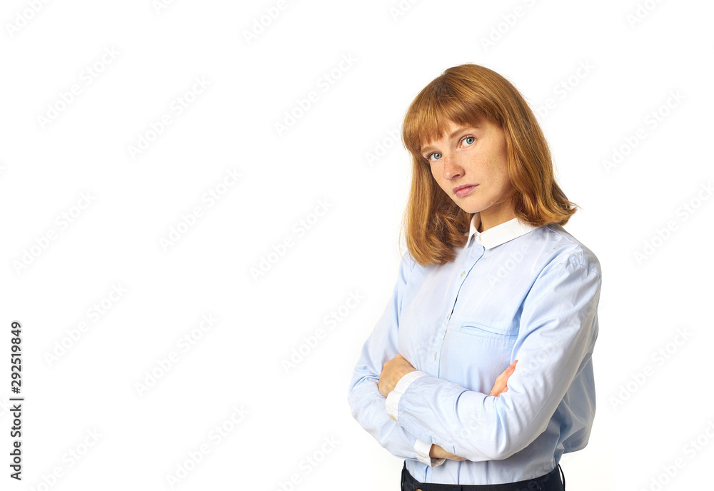 Portrait of beautiful girl with ginger hair, bang and freckles looking at the camera with serious and suspicious face expression as if not believing in something Portrait of beautiful girl with ginger hair, bang and freckles looking at the camera with serious and suspicious face expression as if not believing in something
