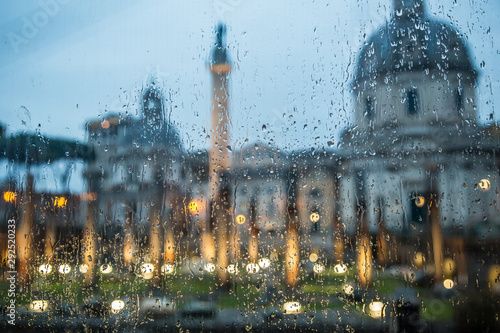 Shot through glass with drops. Selective focus. Imperial forums of Rome. The Forum Of Trajan. Trajan's Column. Rome. Italy photo