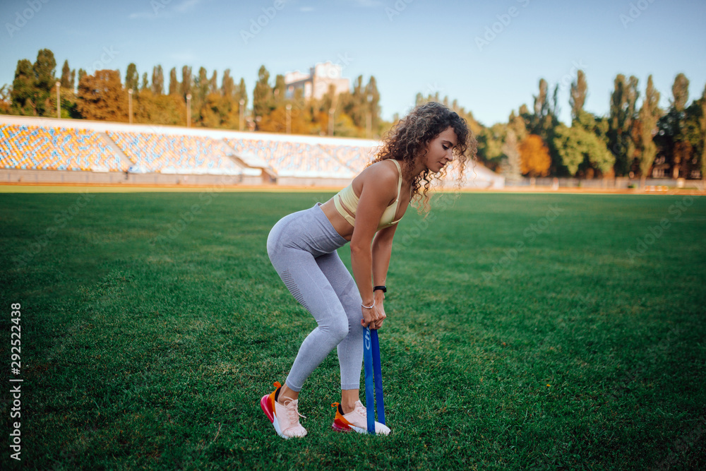 sports beautiful girl at the stadium go in for sports sports beautiful girl at the stadium go in for sports