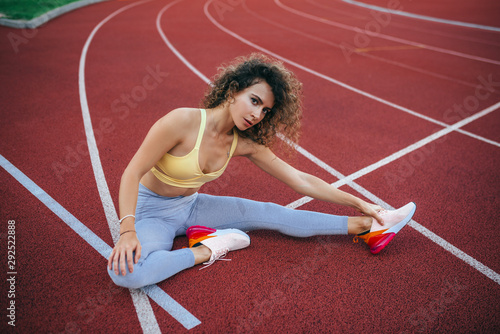 sports beautiful girl at the stadium go in for sports