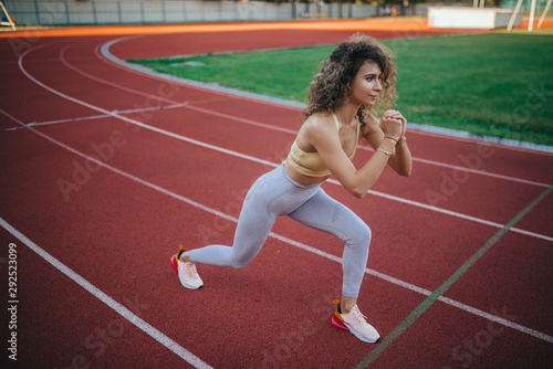 sports beautiful girl at the stadium go in for sports