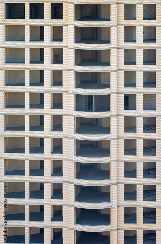 Facade of a multi-storey building under construction Facade of a multi-storey building under construction