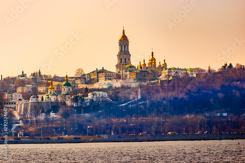 A view of the golden steeples of the Kiev Pechersk Lavra Monastery, in Kiev, Ukraine, seen from the left bank of the Dnieper river during winter