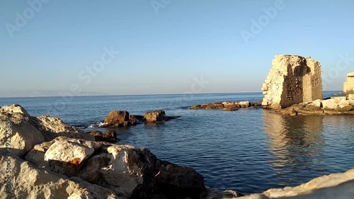 Ruined ancient wall in the sea near Acre, Israel