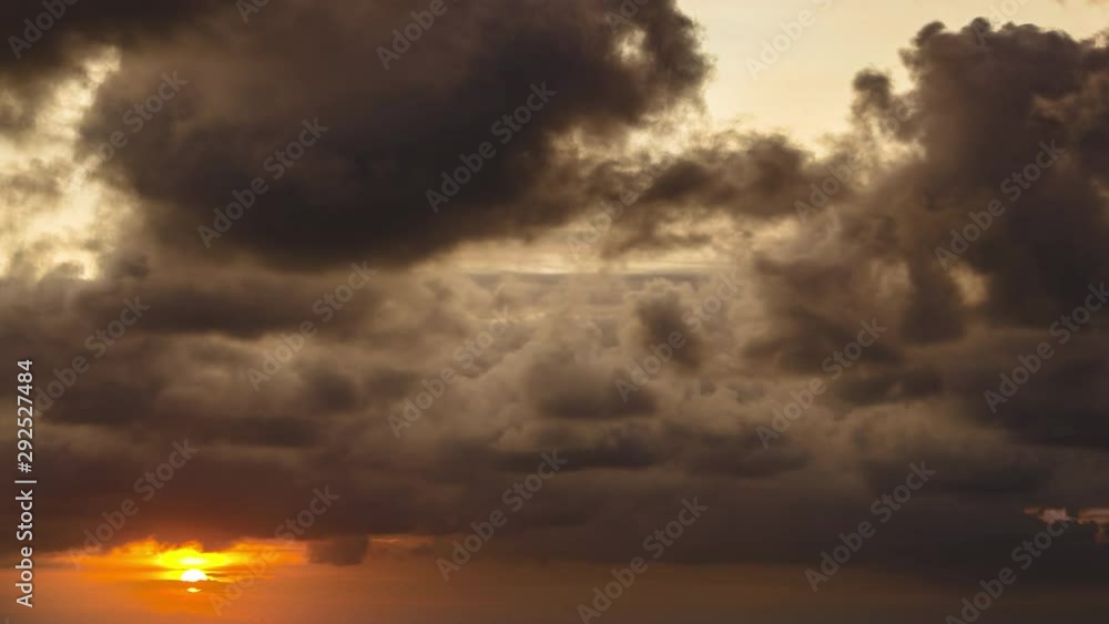 Dramatic time lapse of a sunset with large storm clouds building in the tropics, Bali, Indonesia Dramatic time lapse of a sunset with large storm clouds building in the tropics, Bali, Indonesia