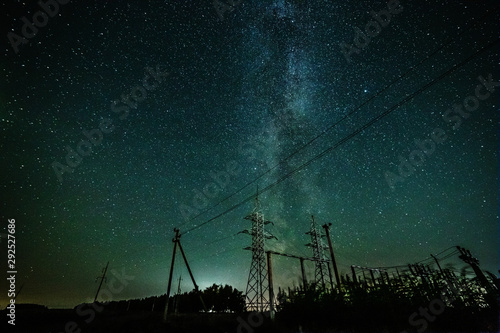 Starry sky and the milky way over the power lines.
