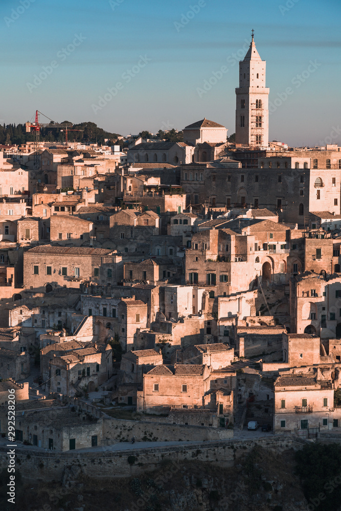 Matera, Italy - August 2019: View of the ancient city of Matera from the Belvedere of Murgia Timone, at the dawn of a day in August 