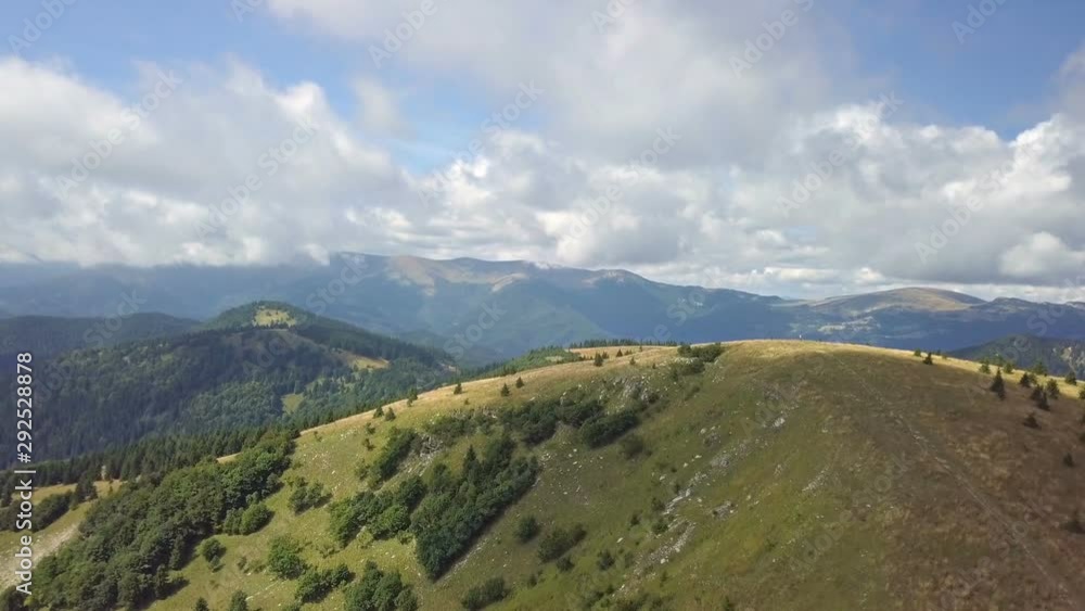 Fly above green Carpathian mountains landscape in sunny summer Fly above green Carpathian mountains landscape in sunny summer