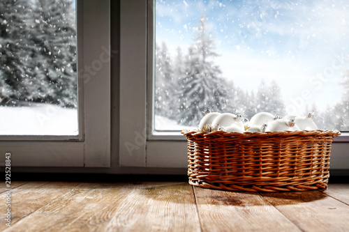 Chrismtas balls on window sill and winter time. 