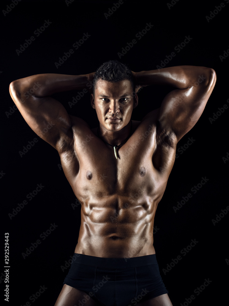 muscular man on black background