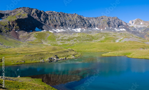 beautiful small emerald lake in a mountain