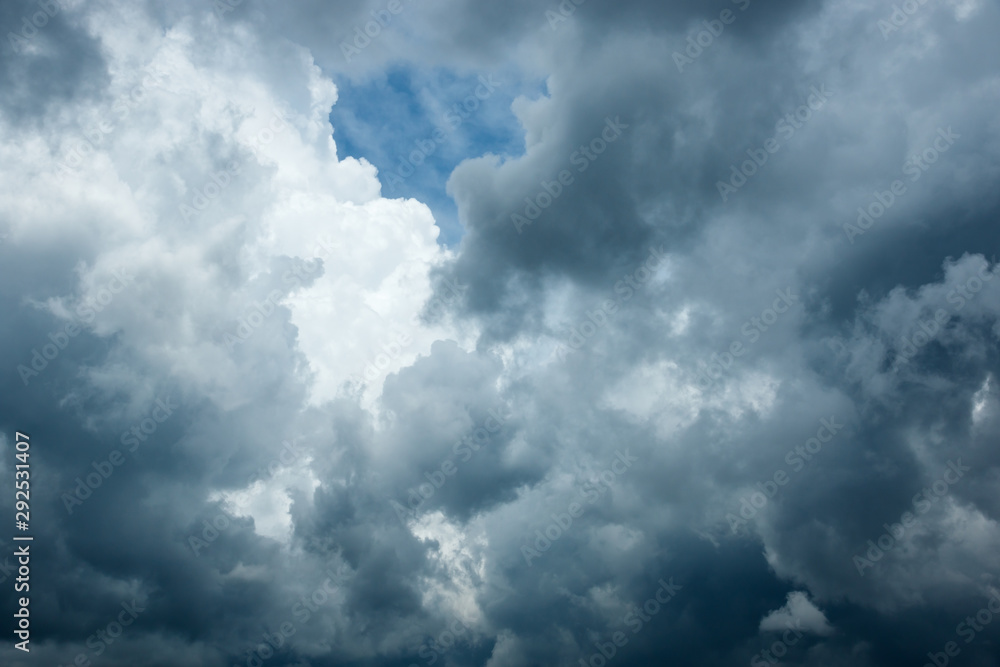 White Cloud and Black Storm Cloud On Sky