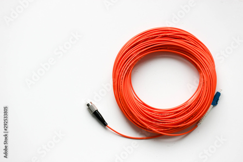 Wallpaper Mural Orange optical fiber network cable with blue and black connectors isolated on white background Torontodigital.ca