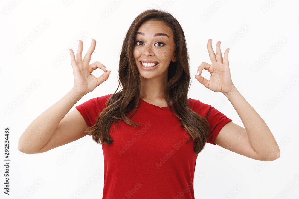 Enthusiastic smiling cute goofy girl in red casual t-shirt smiling excited and upbeat, showing okay, ok gesture, rate good cafe, feeling satisfied, giving personal judgement, approving outfit Enthusiastic smiling cute goofy girl in red casual t-shirt smiling excited and upbeat, showing okay, ok gesture, rate good cafe, feeling satisfied, giving personal judgement, approving outfit