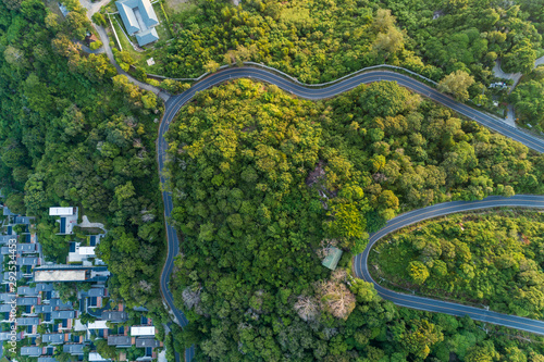 Asphalt road curve on high mountain image by Drone bird's eye view