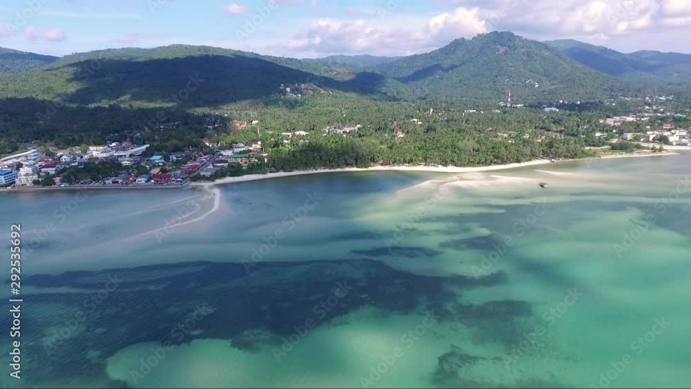 Aerial panning shot of Koh Samui island and shallow, azure Gulf of Thailand. Aerial panning shot of Koh Samui island and shallow, azure Gulf of Thailand.