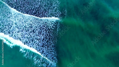 Waves breaking next to a limestone beach
