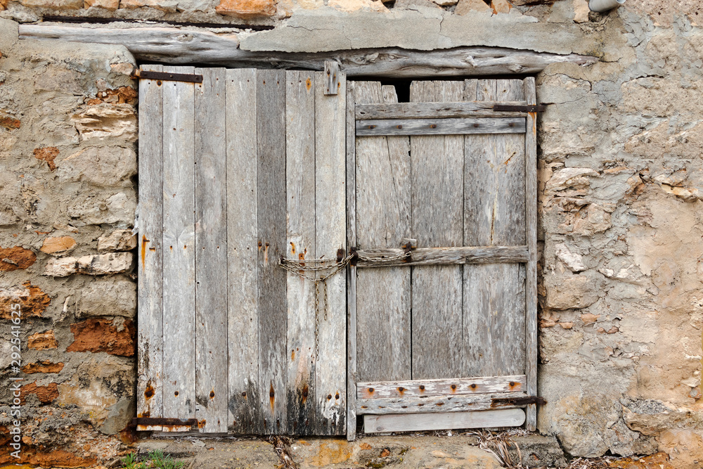 ancient weathered wooden doors of a boat house