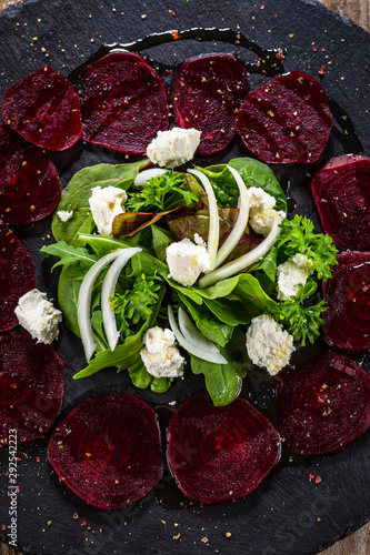 Beetroot with cottage cheese on black stone