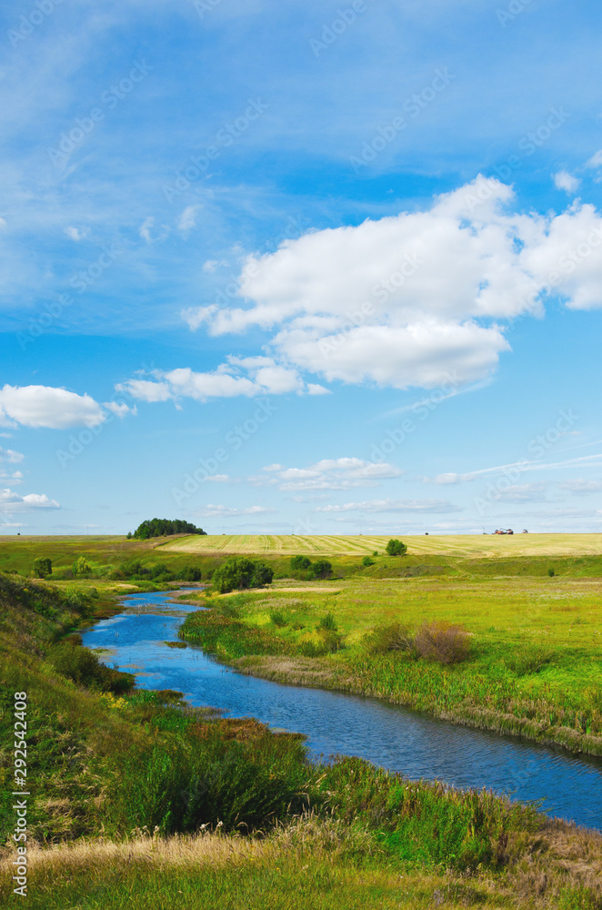 Obraz premium Beautiful summer landscape with river and green hills