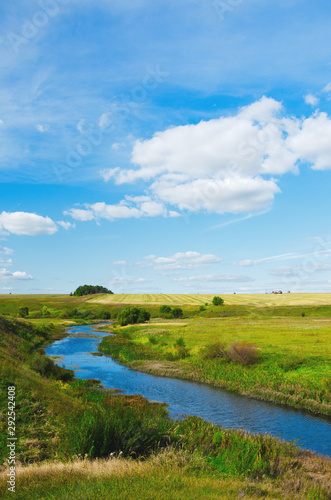 Beautiful summer landscape with river and green hills