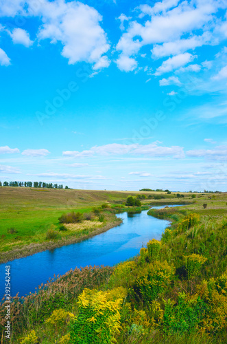 Beautiful summer landscape with river and green hills