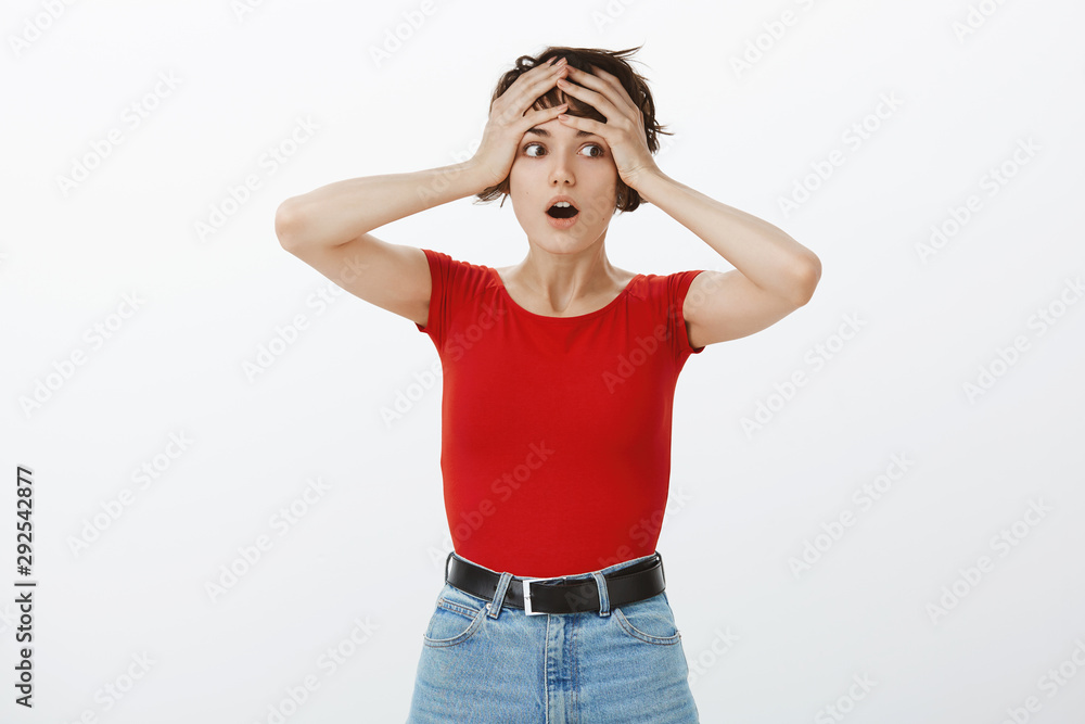 Wait what. Shocked stunned intense gasping woman grab head look aside drop jaw astonished processing amazing shook information look aside cathing breath amazed white background Wait what. Shocked stunned intense gasping woman grab head look aside drop jaw astonished processing amazing shook information look aside cathing breath amazed white background