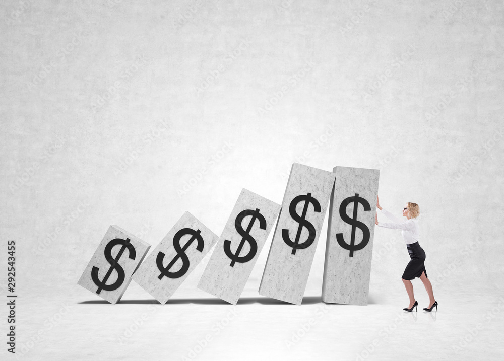 Businesswoman holding falling dollar graph Businesswoman holding falling dollar graph