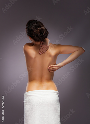 Woman massaging back pain