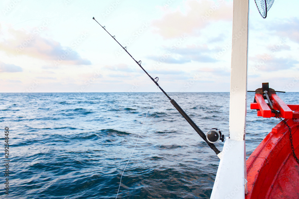 Fishing rod are prepared to offshore fishing on the boat in ocean. Stock  Photo