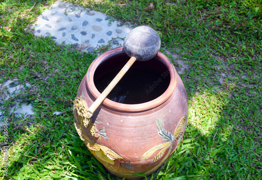 A bowl filled with water and petals of beautiful flowers.