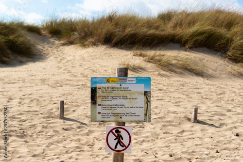 sign prohibiting access to the regeneration sand dune reserve photo