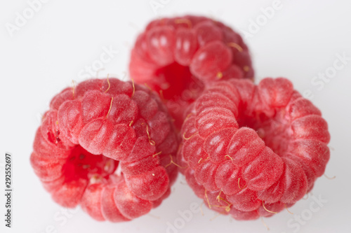 three fresh raspberries