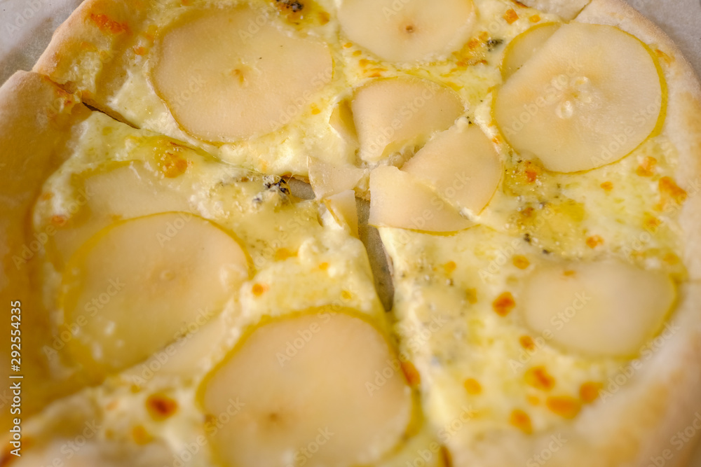 Delicious pizza with Round Pear Slices, Roquefort Blue Cheese served at Italian Restaurant with Plate. Traditional Food Delicious pizza with Round Pear Slices, Roquefort Blue Cheese served at Italian Restaurant with Plate. Traditional Food