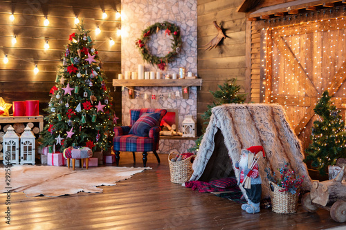 New Year's interior, holiday, Christmas, cozy and warm. Christmas tree and fireplace