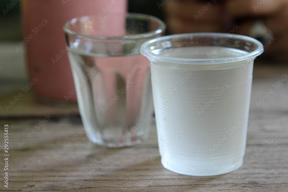Cool drinking water in a clear plastic glass. Cool drinking water in a clear plastic glass.